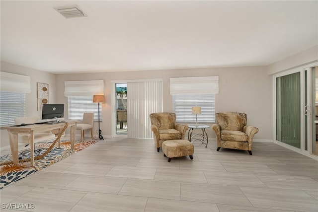 sitting room with light tile patterned floors