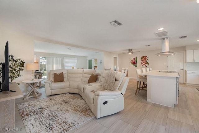 living room featuring ceiling fan