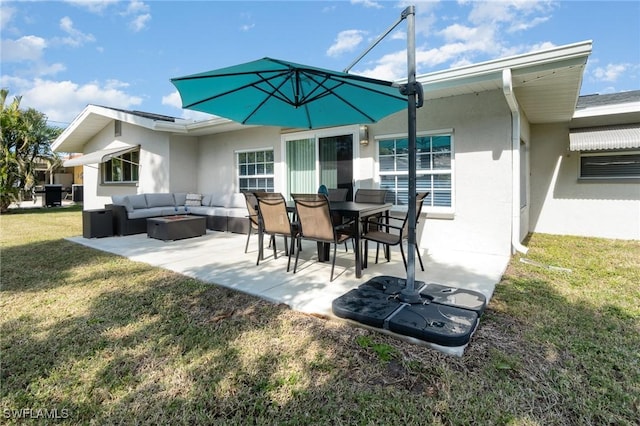 back of property with a patio, an outdoor hangout area, and a yard