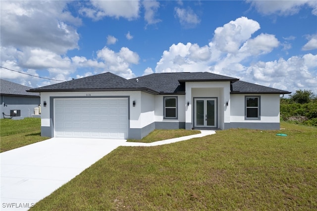 view of front facade with cooling unit, a front yard, and a garage