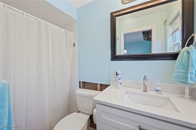 bathroom with vanity and toilet