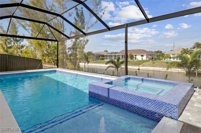 view of swimming pool with a lanai and an in ground hot tub