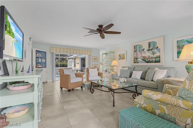 tiled living room featuring ceiling fan