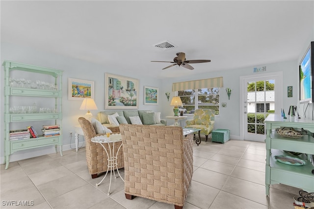 living room with light tile patterned floors and ceiling fan