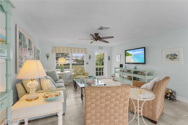 tiled living room with ceiling fan