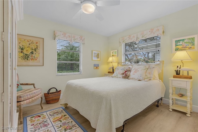 bedroom featuring wood-type flooring and ceiling fan