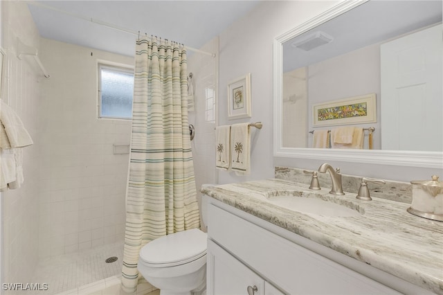 bathroom featuring vanity, toilet, and a shower with shower curtain