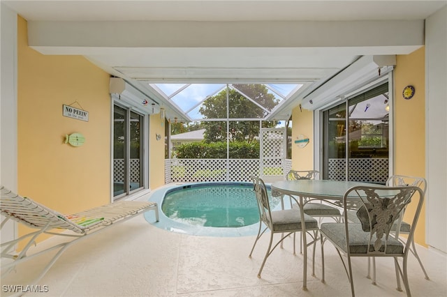 view of pool with a lanai and a patio area