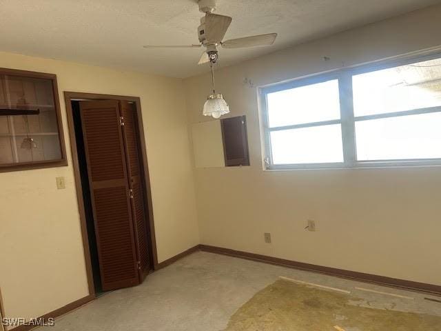 unfurnished room with ceiling fan