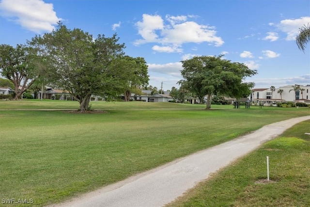 view of home's community featuring a residential view and a lawn