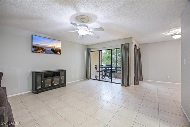 unfurnished living room featuring light tile patterned floors, ceiling fan, baseboards, and a textured ceiling