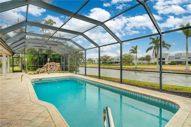 view of pool featuring a water view, a lanai, and a patio area