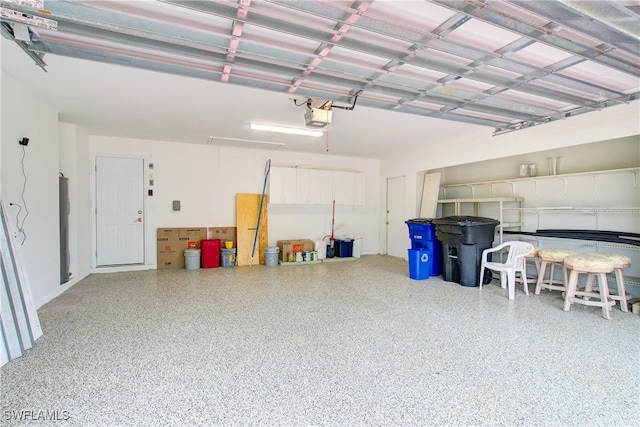 garage featuring a garage door opener