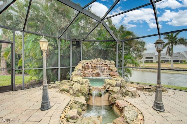 view of patio featuring pool water feature and glass enclosure