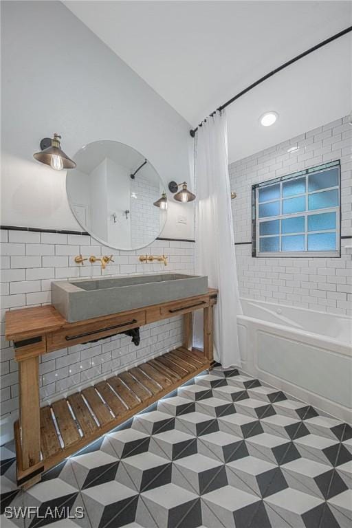 bathroom with lofted ceiling and shower / tub combo