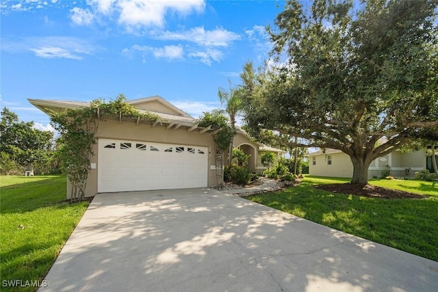 view of front of house featuring a front lawn and a garage