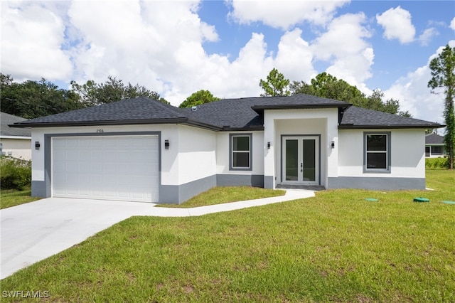 view of front facade with a front lawn, a garage, and french doors