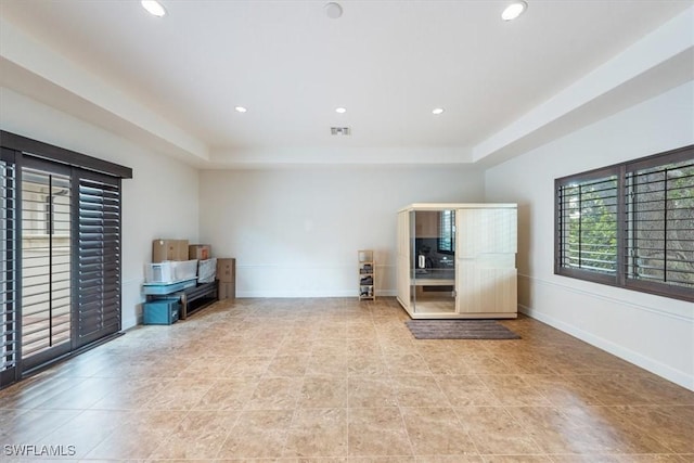 interior space with a tray ceiling