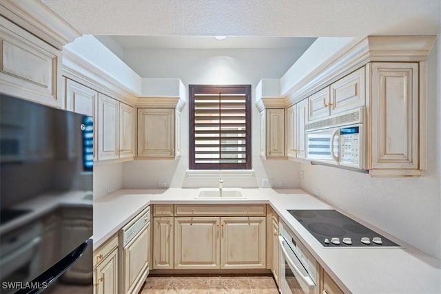 kitchen with sink and white appliances