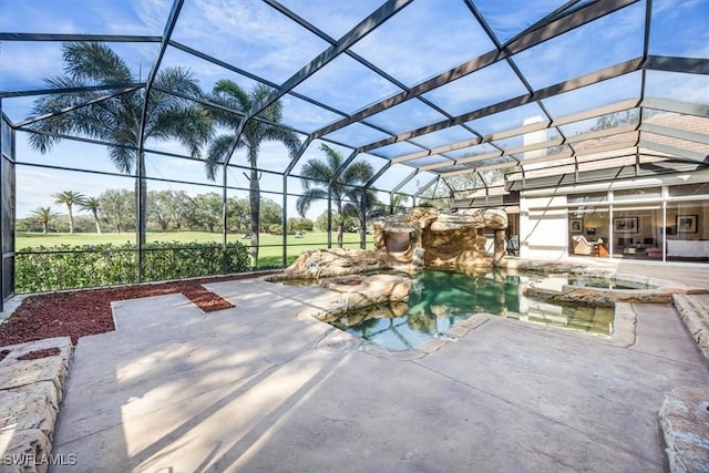 view of patio / terrace featuring glass enclosure and a swimming pool with hot tub