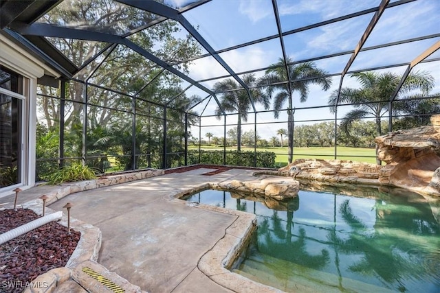 view of swimming pool with a patio and glass enclosure