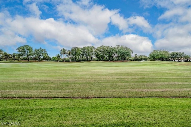 view of property's community with a lawn