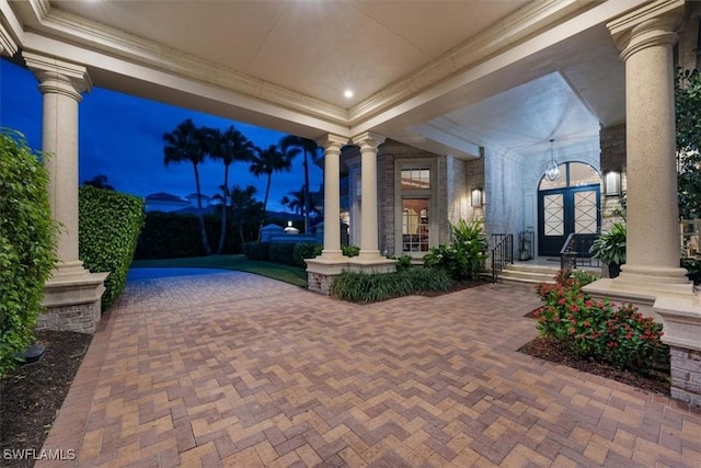 view of patio terrace at dusk