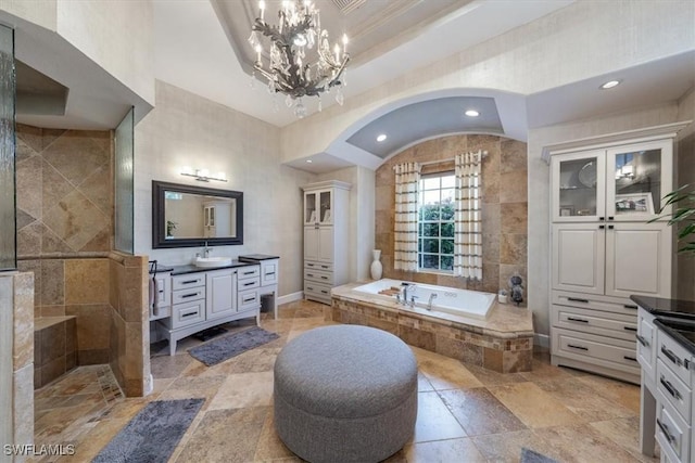 bathroom featuring vanity and separate shower and tub