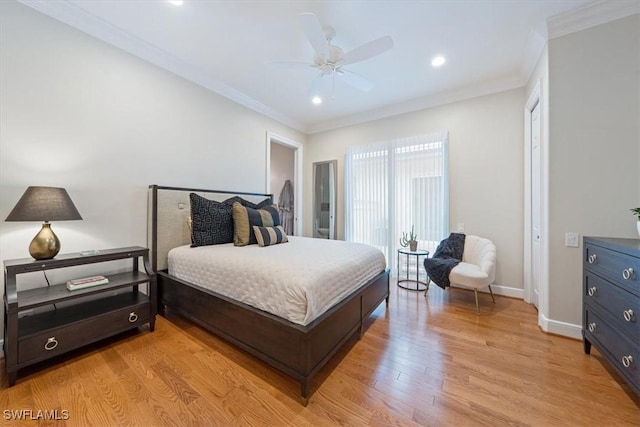 bedroom featuring crown molding, light wood-type flooring, and ceiling fan