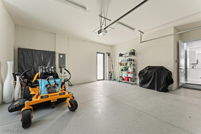 garage featuring a garage door opener and electric panel