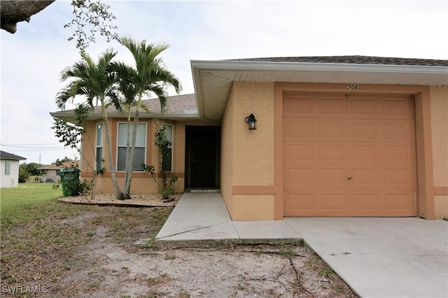 view of exterior entry featuring a garage