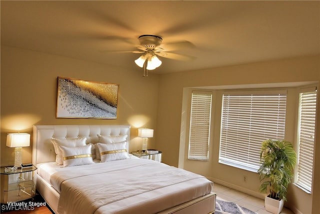 bedroom featuring ceiling fan and light tile patterned flooring