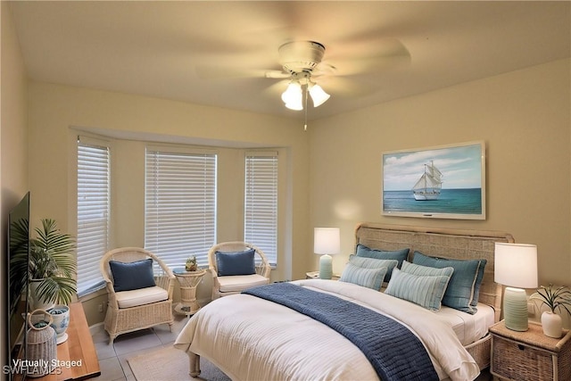 bedroom featuring light tile patterned floors and ceiling fan