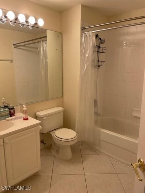 full bathroom featuring shower / tub combo, vanity, toilet, and tile patterned flooring