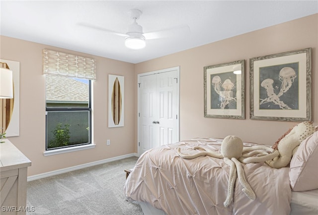 bedroom with light carpet, a closet, and ceiling fan