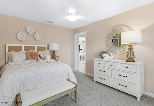 bedroom with light colored carpet and ceiling fan