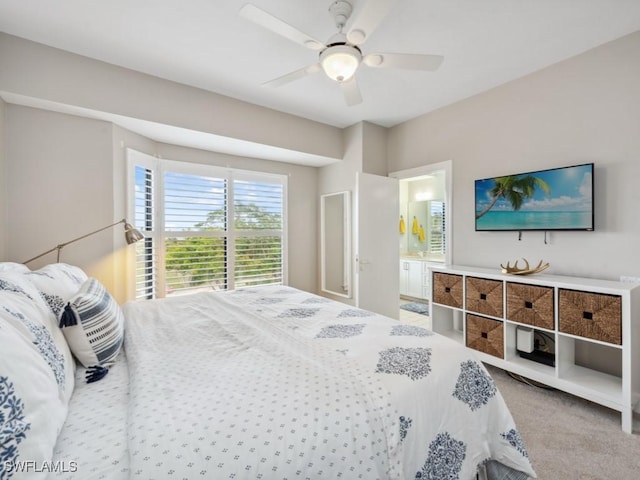 bedroom featuring carpet floors, ceiling fan, and ensuite bathroom