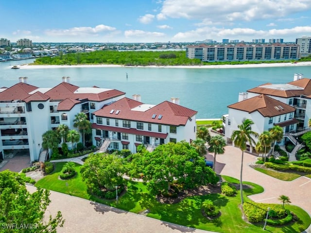 birds eye view of property with a water view