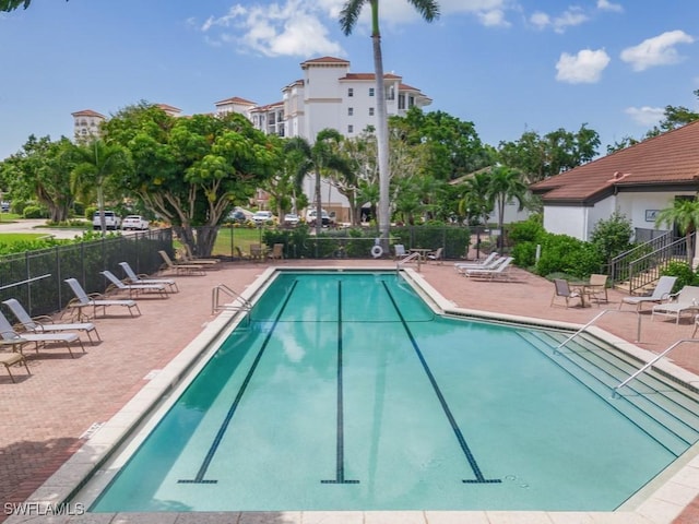 view of swimming pool featuring a patio area