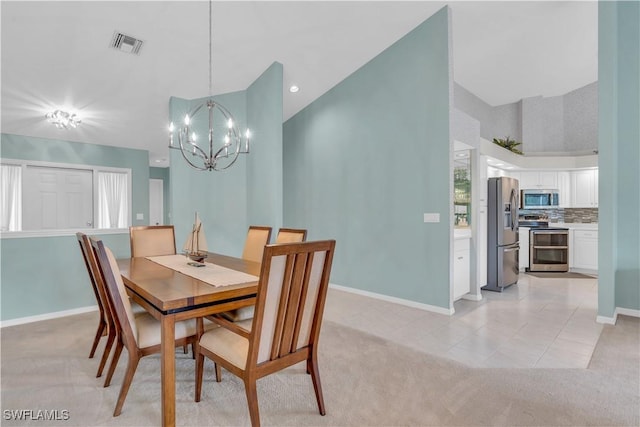 tiled dining space with a notable chandelier