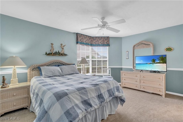 bedroom featuring ceiling fan and light carpet