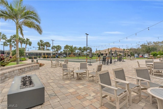 view of patio with an outdoor fire pit