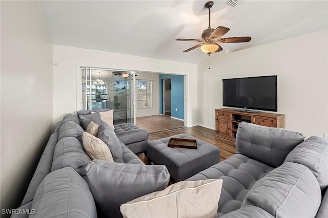 living room featuring ceiling fan and hardwood / wood-style floors