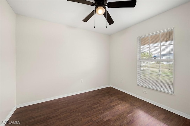 empty room with dark wood-type flooring