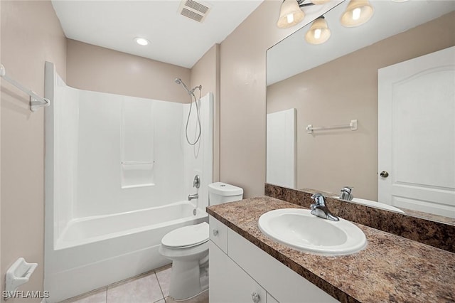 full bathroom featuring toilet, vanity, tile patterned floors, and shower / bathing tub combination