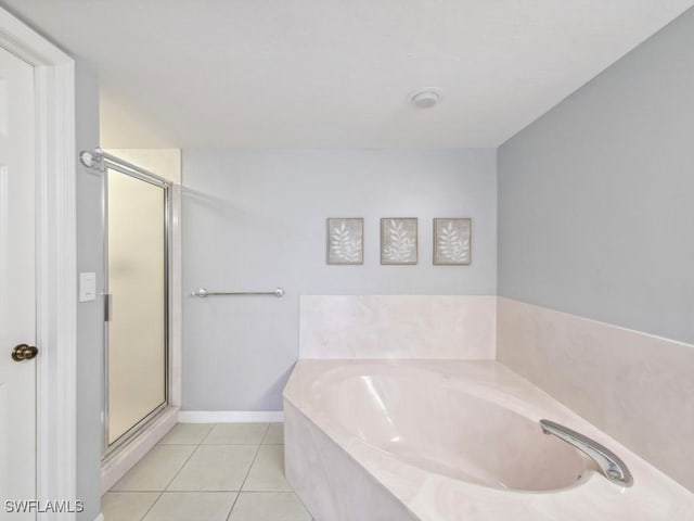 bathroom featuring shower with separate bathtub and tile patterned flooring