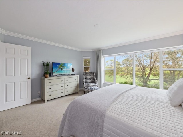 bedroom with ornamental molding and light carpet