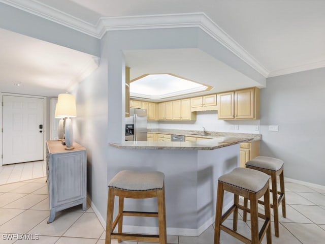 kitchen featuring stainless steel appliances, ornamental molding, sink, and light stone counters