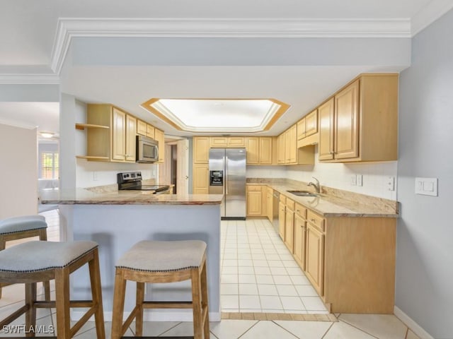 kitchen with stainless steel appliances, crown molding, light brown cabinetry, and kitchen peninsula