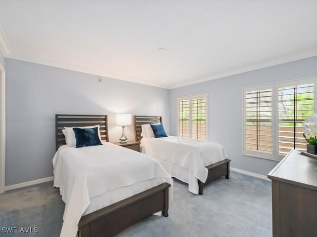 bedroom featuring ornamental molding, carpet floors, and multiple windows